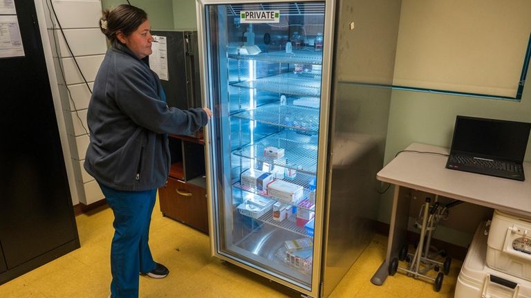 Lead medical assistant Beatriz Nunez organizes vaccines at Alliance Medical...