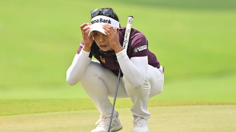 Patty Tavatanakit of Thailand lines up a putt on the...