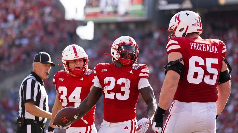 Nebraska's Anthony Grant (23) celebrates after scoring a touchdown with...