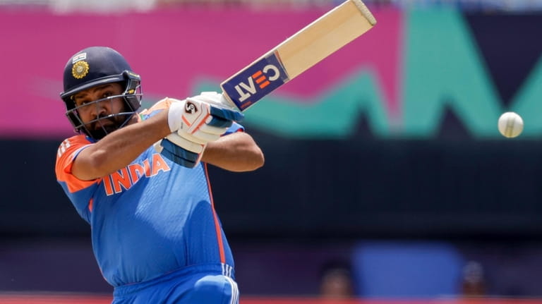 India captain Rohit Sharma plays a shot against Ireland during...