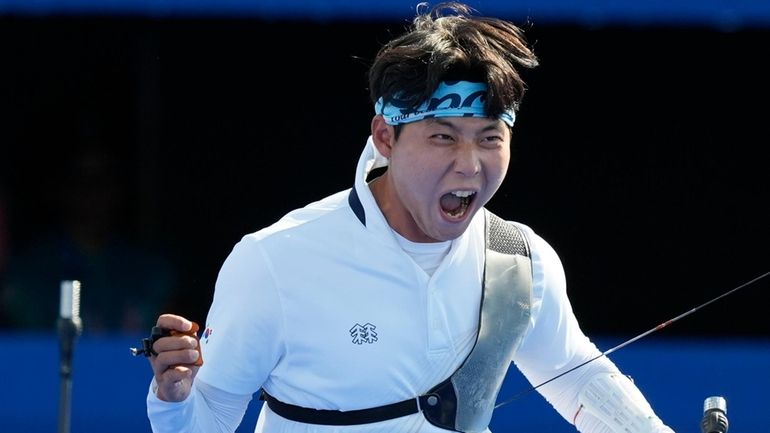 South Korea's Wooseok Lee celebrates with after a win during...