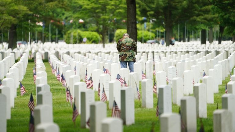 In honor of Memorial Day, volunteers from Boy Scout, Girl...