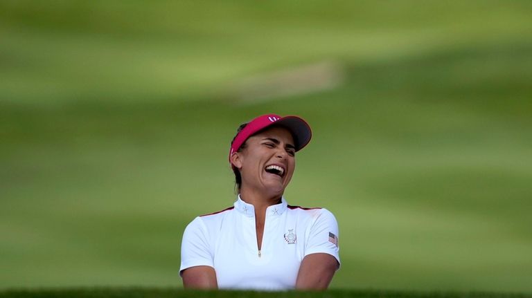 United States' Lexi Thompson laughs on the third green during...