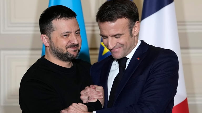 Ukrainian President Volodymyr Zelenskyy, left, and French President Emmanuel Macron...