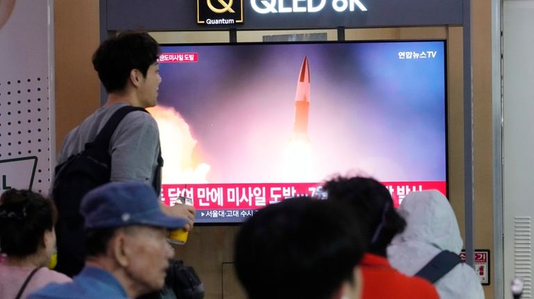 A TV screen shows a file image of North Korea's...