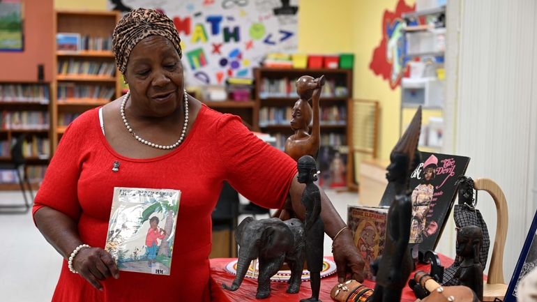 The Rev. Bernadette Watkins, a Huntington community activist, with some...