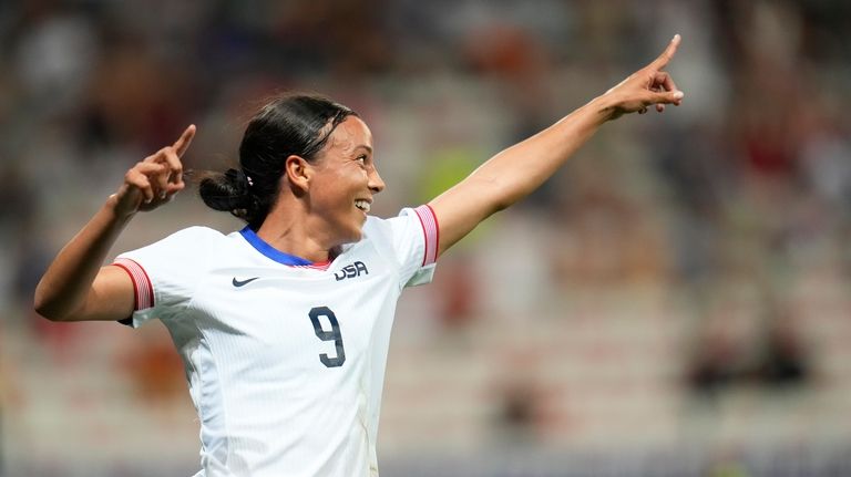 United States' Mallory Swanson reacts after scoring her side's third...