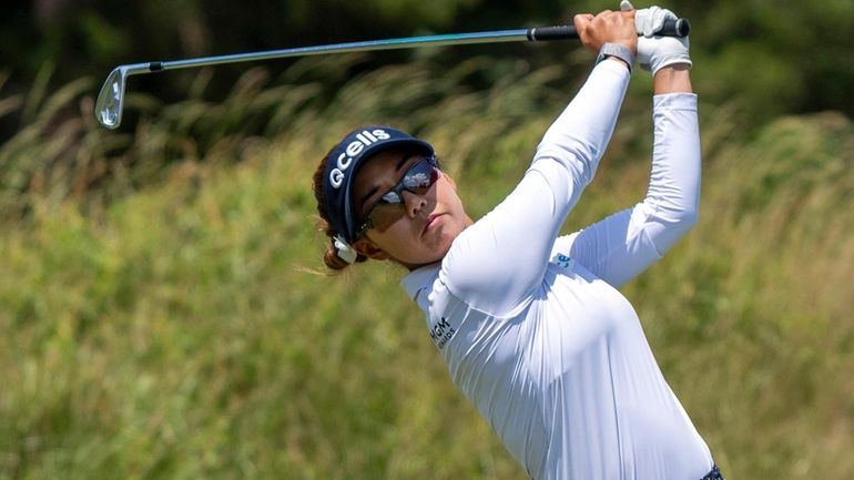 Jenny Shin, of South Korea, tees off on the 11th...