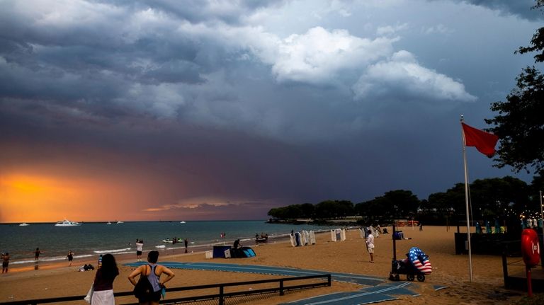 A storm rolls in at Ohio Street beach after a...