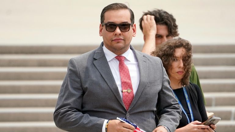 Rep. George Santos outside federal court in Central Islip.