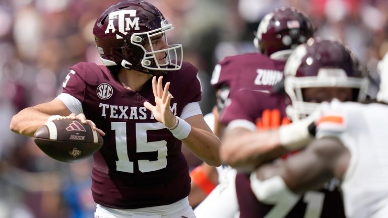 Texas A&M quarterback Conner Weigman (15) throws down field against...