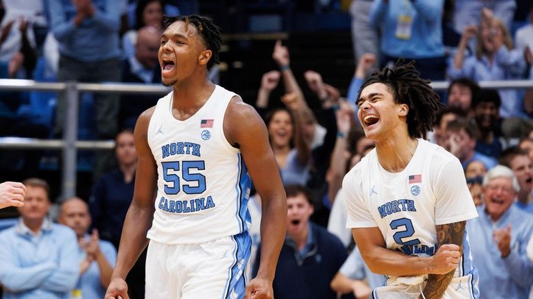 North Carolina's Elliot Cadeau (2) and Harrison Ingram (55) celebrate...