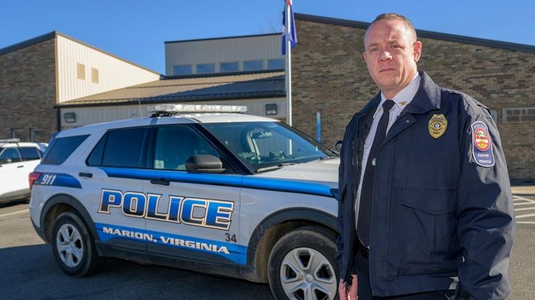 Marion Police Chief John Clair poses outside the Marion Police...