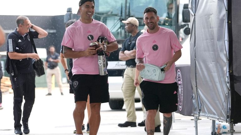 Inter Miami forward Luis Suarez, left, and forward Lionel Messi,...