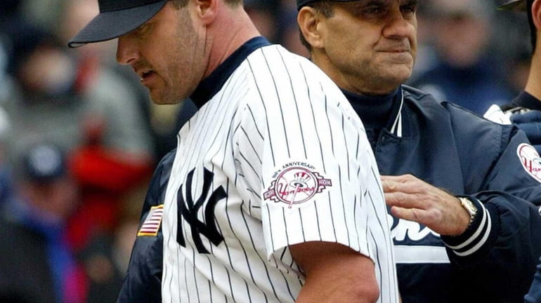 Former Yankees' manager Joe Torre visits Rogers Clemens on the...
