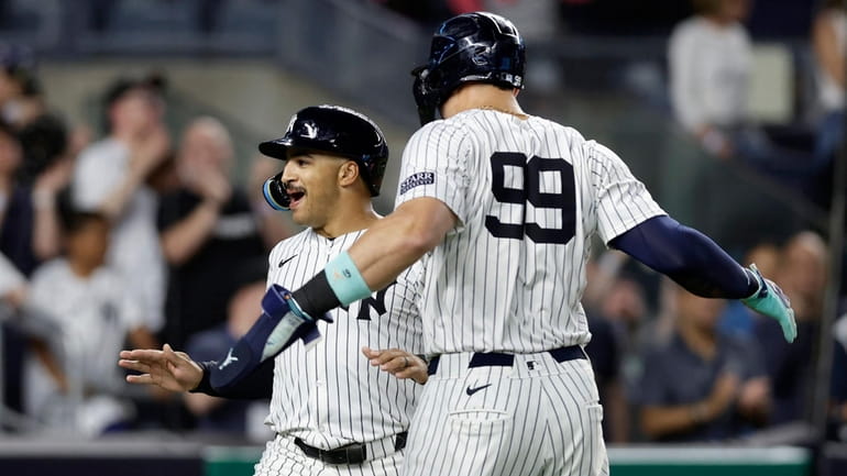 Trent Grisham of the Yankees celebrates his sixth-inning three-run home run against...