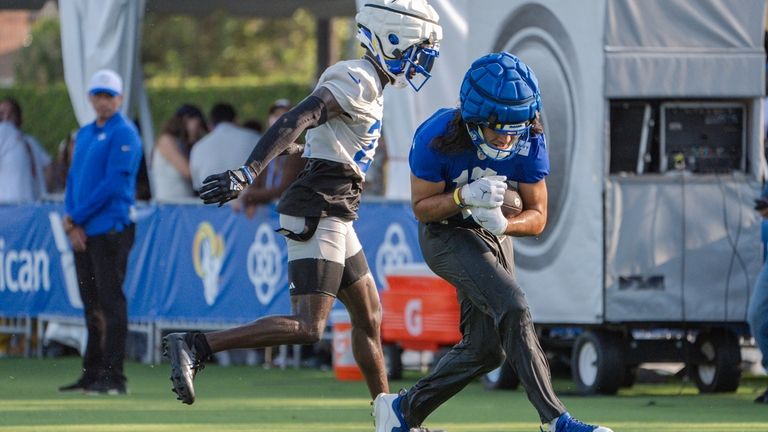 Los Angeles Rams cornerback Tre'Davious White (27) left, chases wide...