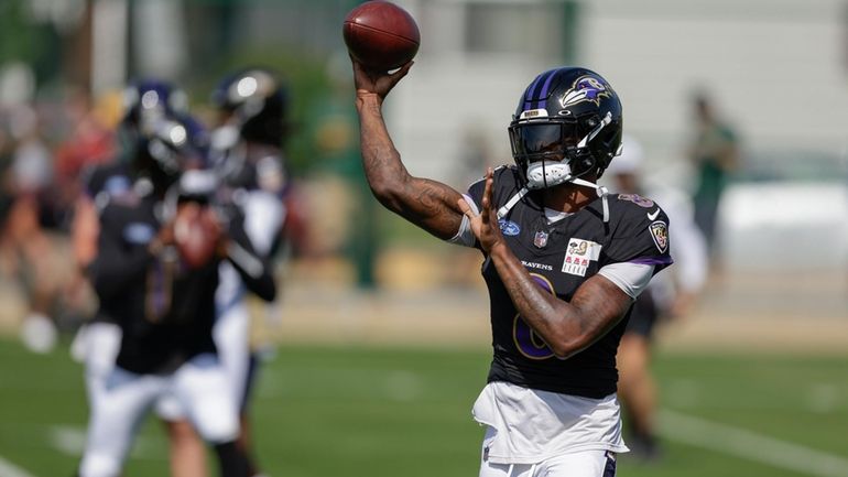 Baltimore Ravens quarterback Lamar Jackson throws a pass during an...