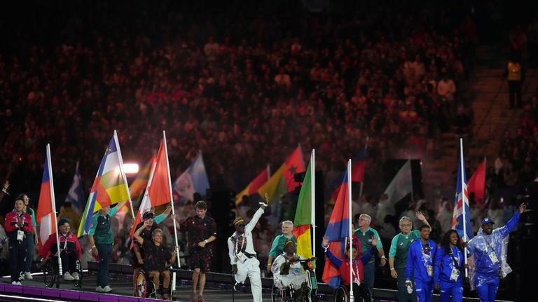 Athletes from different delegations parade during the closing ceremony of...