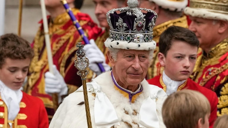 Britain's King Charles III departs Westminster Abbey after his coronation...