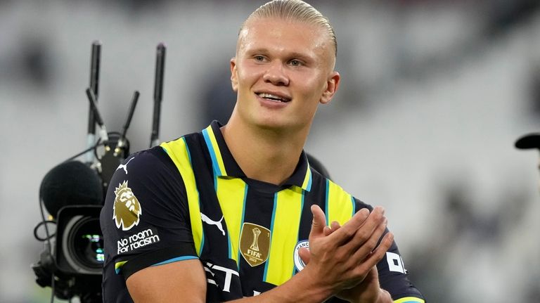 Manchester City's Erling Haaland reacts at the end of the...