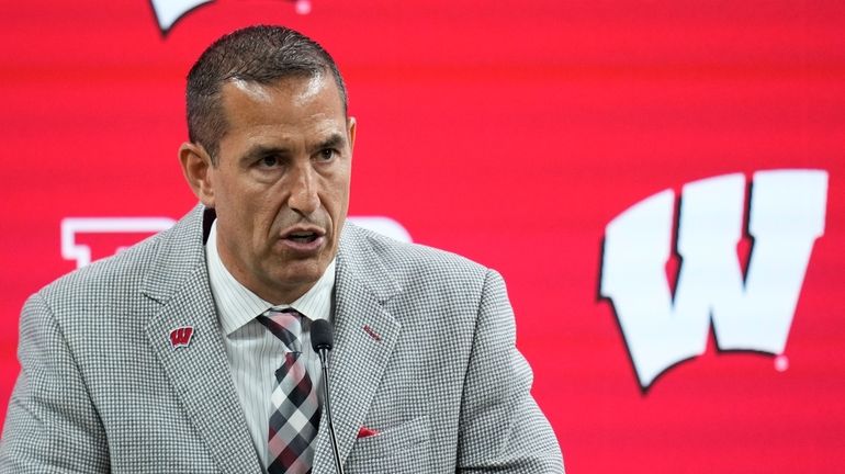 Wisconsin head coach Luke Fickell speaks during an NCAA college...