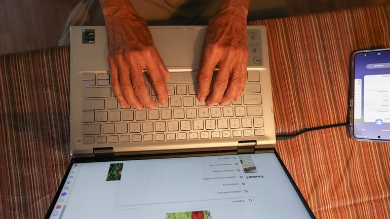 Barbara Winston uses a computer at her home in Northbrook,...