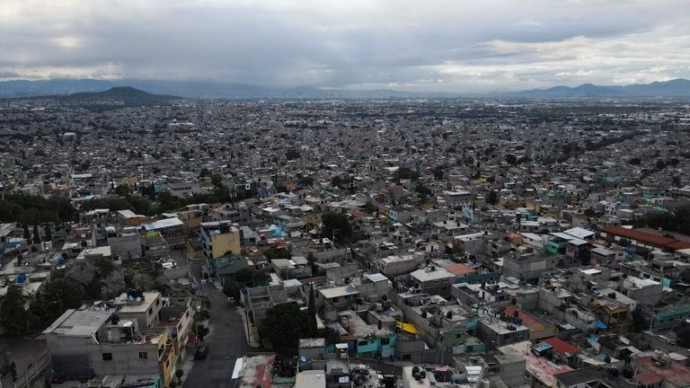 Water storage units sit on rooftops in the Iztapalpa neighborhood...