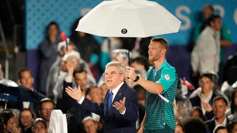 Thomas Bach, President of the IOC, speaks in Paris, France,...