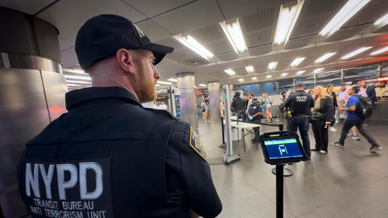 Gun detection machines are tested at the Fulton Street transit...