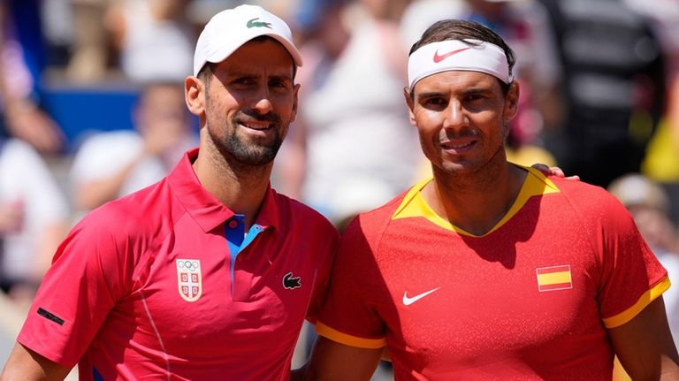 Rafael Nadal, right, and Novak Djokovic pose before their men's...