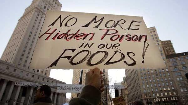 A protester holds this sign at a rally against trans...