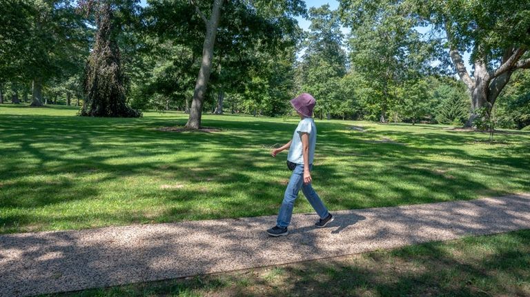 A community member at Bayard Cutting Arboretum in Great River,...