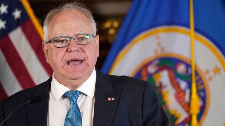 Minnesota Gov. Tim Walz speaks to the media, Nov. 9,...