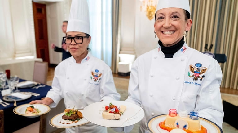 White House executive chef Cris Comerford, left, and White House...