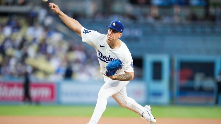 Los Angeles Dodgers starting pitcher Bobby Miller throws during the...