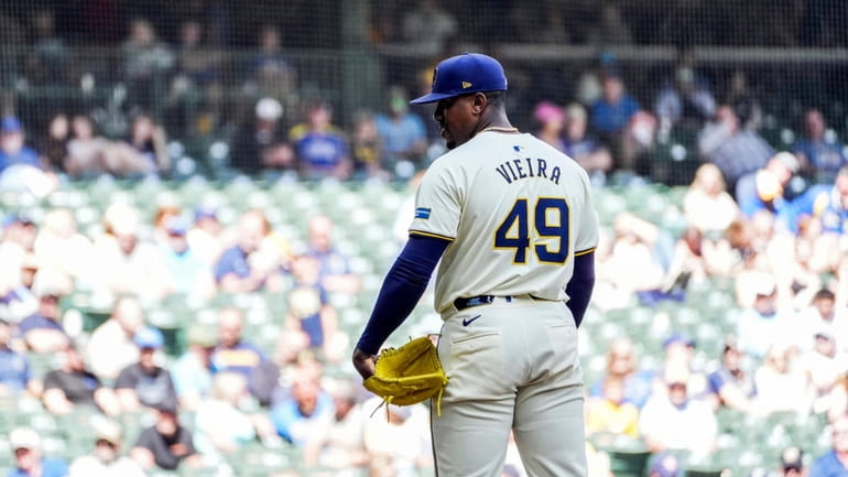 Milwaukee Brewers' Thyago Vieira gets set to pitch against the...