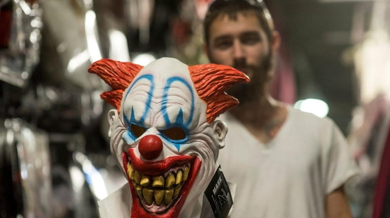 Movie review: Fear wears a creepy clown face in 'It