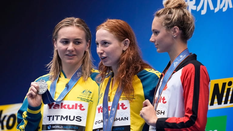 Medalists, from left to right, Ariarne Titmus of Australia, silver,...