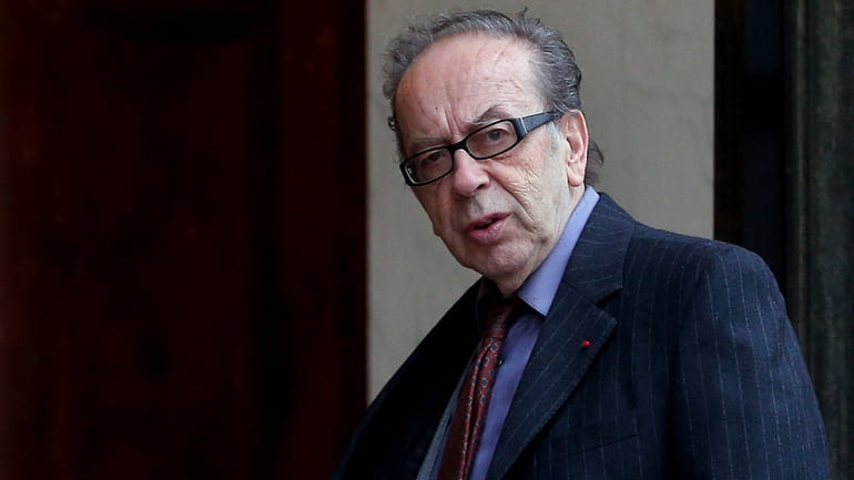 Albanian novelist Ismail Kadare arrives at the Elysee Palace to...