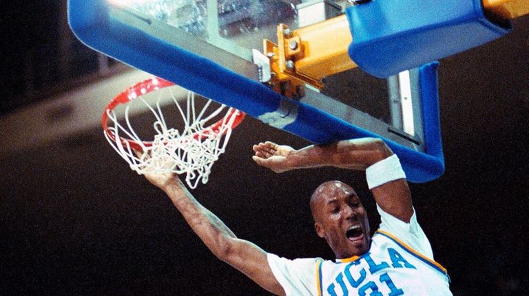 UCLA forward Ed O'Bannon slam during a basket in UCLA's...