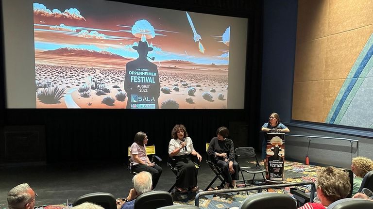 Panelists answer questions during a discussion following the first screening...