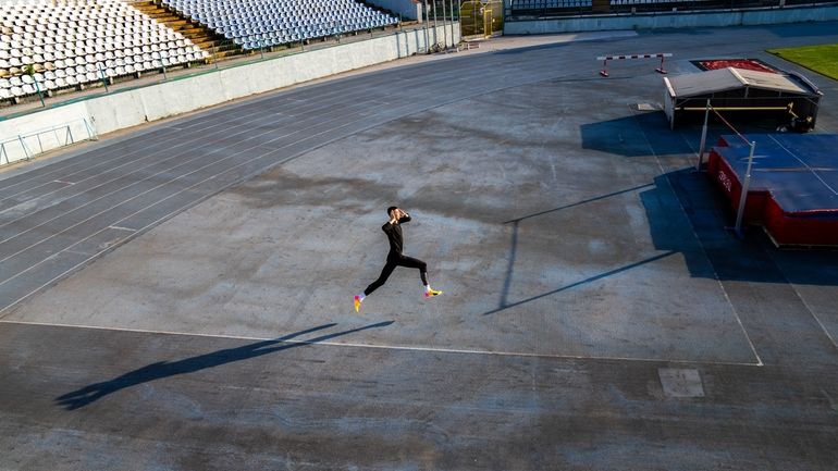 High jumper Oleh Doroshchuk works out during a training session...