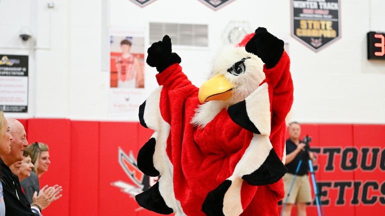 The Connetquot Thunderbird mascot cheers at a Suffok boys volleyball match...