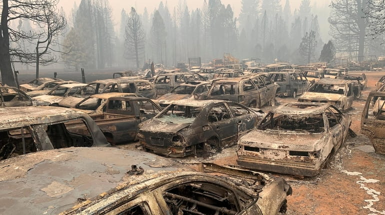 Burnt vehicles seen in Greenville, California, Thursday as the Dixie Wildfire, the...