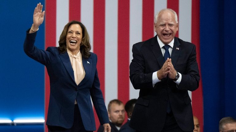 Democratic presidential nominee Vice President Kamala Harris and her running...