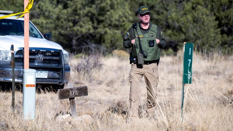 A member of the Custer County Sheriff's Office works the...