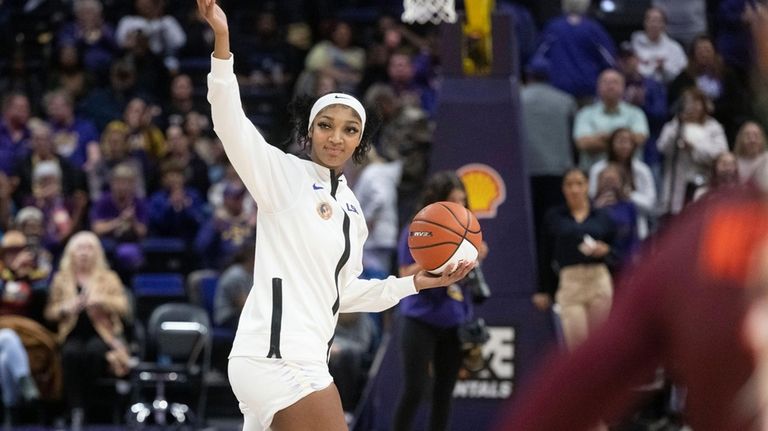 LSU forward Angel Reese (10) is recognized for 1,000 career...