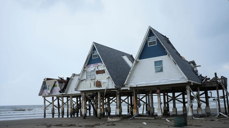 A-frame houses are seen the day after Hurricane Beryl made...