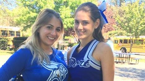 Paul D. Schreiber High School cheerleading coach Nataly Giannuzzi, left,...